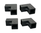 Four black plastic brackets on a white background