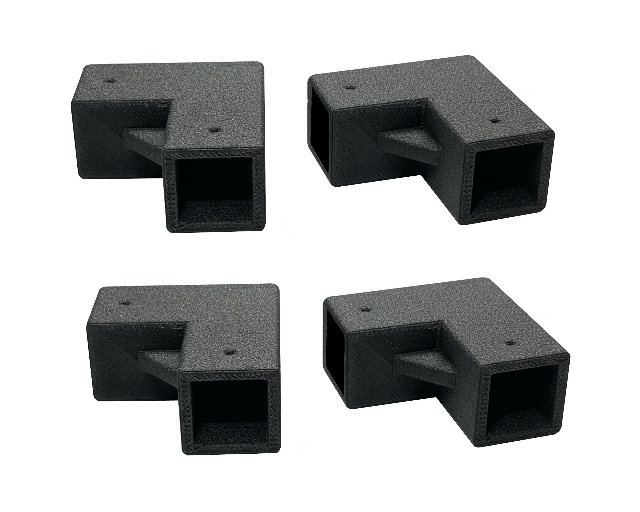 Four black plastic brackets on a white background