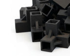Stack of black square-shaped objects on a white background